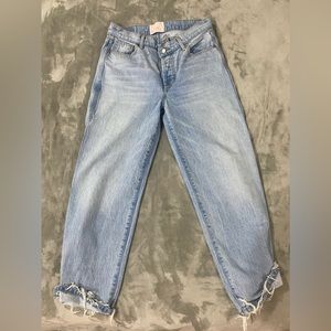 Size 30, asymmetrical jeans.